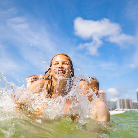 Girl swimming in ocean